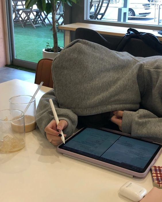 Young students are tired and sleeping on the desk with iPad
