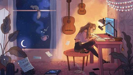Young girl in a cozy room working with a computer at night